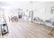 Spacious living room with hardwood floors, open layout, and ample seating areas at 617 Deepwood Ct, Moncks Corner, SC 29461