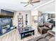 Comfortable living room featuring a fireplace, leather furniture, and wood-look vinyl floors at 617 Deepwood Ct, Moncks Corner, SC 29461