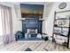 Cozy living room with fireplace, decorative shelving, and wood-look vinyl floors at 617 Deepwood Ct, Moncks Corner, SC 29461