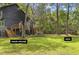 Expansive backyard featuring lush greenery and a charming ADU nestled among the trees at 6464 Saint Anthony Dr, Meggett, SC 29449