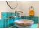 Stylish bathroom featuring a unique basin sink, brass hardware, and colorful tiling at 6464 Saint Anthony Dr, Meggett, SC 29449