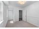 Bright bedroom with neutral carpet and white trim features closet and bathroom access at 6464 Saint Anthony Dr, Meggett, SC 29449