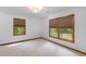 Bright bedroom with white walls, plush carpet and large windows with natural light at 6464 Saint Anthony Dr, Meggett, SC 29449