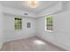 Sun-filled bedroom with neutral carpet, decorative molding and large windows at 6464 Saint Anthony Dr, Meggett, SC 29449