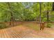 Wood deck area with railings and view of the backyard landscape at 6464 Saint Anthony Dr, Meggett, SC 29449