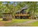 Inviting screened in porch with a wooded view at 6464 Saint Anthony Dr, Meggett, SC 29449