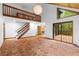 Spacious living room featuring high ceilings, staircase, unique tiling and natural lighting at 6464 Saint Anthony Dr, Meggett, SC 29449