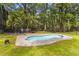 Inviting backyard pool featuring a custom concrete surround and ample space for lounging at 6464 Saint Anthony Dr, Meggett, SC 29449