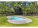 Inviting backyard pool featuring a custom concrete surround and ample space for lounging at 6464 Saint Anthony Dr, Meggett, SC 29449