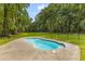 Inviting backyard pool featuring a custom concrete surround and ample space for lounging at 6464 Saint Anthony Dr, Meggett, SC 29449