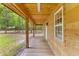 Relaxing outdoor space with a wooden porch overlooking a lush, green backyard at 6464 Saint Anthony Dr, Meggett, SC 29449
