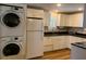 Bright kitchen with new appliances, white cabinetry, and black countertops at 65 Vanderhorst St # C, Charleston, SC 29403