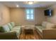 Well-lit living room with hardwood floors, neutral walls and two comfortable couches at 65 Vanderhorst St # C, Charleston, SC 29403