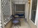 Inviting porch with comfortable seating, lattice details and a cozy atmosphere at 65 Vanderhorst St # C, Charleston, SC 29403