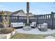 Cozy backyard features a patio with comfortable seating around a fire pit and stylish landscaping at 711 Blueway Ave, Summerville, SC 29486