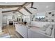 Spacious open-concept living area with vaulted ceilings, wooden beams, and seamless flow to the kitchen at 711 Blueway Ave, Summerville, SC 29486