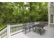 Outdoor space with deck, black metal furniture set, and lush green surroundings at 74 Hospitality St, Mount Pleasant, SC 29464