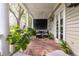 Inviting back porch featuring cozy seating, a ceiling fan, and serene outdoor views at 74 Hospitality St, Mount Pleasant, SC 29464