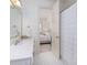 Clean bathroom with white tile flooring, single vanity, and a combined shower/tub at 74 Hospitality St, Mount Pleasant, SC 29464