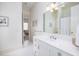 Bright bathroom with hexagon tile, white cabinets, and a large mirror reflecting a shower/tub at 74 Hospitality St, Mount Pleasant, SC 29464