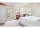 Bright bedroom featuring a covered porch through french doors, neutral decor and natural light at 74 Hospitality St, Mount Pleasant, SC 29464