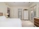 Neutral colored bedroom with doors to covered porch, and access to other rooms at 74 Hospitality St, Mount Pleasant, SC 29464