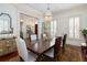 Formal dining room featuring hardwood floors, elegant lighting, and ample seating at 74 Hospitality St, Mount Pleasant, SC 29464
