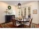 Classic dining room with dark wood table, and french doors at 74 Hospitality St, Mount Pleasant, SC 29464