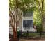 Beautiful home exterior with a porch, a black fence, and mature trees at 74 Hospitality St, Mount Pleasant, SC 29464