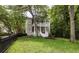 Inviting two-story home with a manicured lawn, double porches, and classic curb appeal at 74 Hospitality St, Mount Pleasant, SC 29464