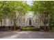 Beautifully landscaped home featuring classic architecture, a welcoming entrance, and mature trees at 74 Hospitality St, Mount Pleasant, SC 29464