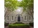 Inviting home showcasing symmetrical architecture, a manicured front garden, and charming entry at 74 Hospitality St, Mount Pleasant, SC 29464