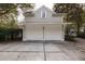 Detached two-car garage with neutral siding and a well-lit driveway at 74 Hospitality St, Mount Pleasant, SC 29464