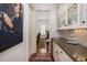 Hallway with a large painting, leading to the kitchen at 74 Hospitality St, Mount Pleasant, SC 29464