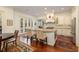 Bright kitchen with stainless steel appliances, a center island, dining room, and french doors at 74 Hospitality St, Mount Pleasant, SC 29464