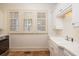 Bright laundry room with sink, cabinets, and large windows at 74 Hospitality St, Mount Pleasant, SC 29464