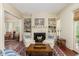 Cozy living room with a fireplace, built-in shelves, and stylish seating at 74 Hospitality St, Mount Pleasant, SC 29464