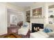 Inviting living room with fireplace, built-in shelving and natural light at 74 Hospitality St, Mount Pleasant, SC 29464
