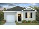 Charming single-story home featuring a garage, inviting front door, and well-manicured landscaping at 8030 Rackham Rd, Hollywood, SC 29470