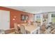 Cozy living room with a wood table, comfortable seating, and a bright open layout to the dining area at 8030 Rackham Rd, Hollywood, SC 29470