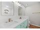 Bright bathroom with a double vanity, round window, and luxury finishes at 8340 Coventry Ct, North Charleston, SC 29420