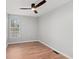 Empty bedroom with a ceiling fan, wood-look floors, and a window at 8340 Coventry Ct, North Charleston, SC 29420