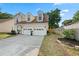 Charming home with a two-car garage, dormer windows, and well-maintained landscaping at 8340 Coventry Ct, North Charleston, SC 29420