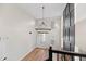 Grand foyer with a statement chandelier, soaring ceilings, and wood-look floors at 8340 Coventry Ct, North Charleston, SC 29420