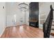 Bright living room features high ceilings, a modern fireplace, and sleek hardwood floors at 8340 Coventry Ct, North Charleston, SC 29420