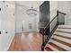 Bright living room features high ceilings, a modern fireplace, and sleek hardwood floors at 8340 Coventry Ct, North Charleston, SC 29420