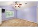 Spacious bedroom with a vaulted ceiling and a large window offering ample natural light at 8739 Grassy Oak Trl, North Charleston, SC 29420