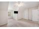 Spacious bedroom with neutral carpet, a ceiling fan, and a window providing natural light at 8739 Grassy Oak Trl, North Charleston, SC 29420