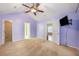 Bedroom with an attached closet and a modern ceiling fan for added comfort at 8739 Grassy Oak Trl, North Charleston, SC 29420