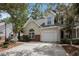 Charming home featuring a one-car garage, manicured landscaping, and a welcoming front entrance at 8739 Grassy Oak Trl, North Charleston, SC 29420